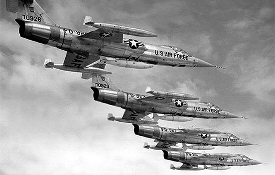 four Lockheed F-104 Starfighters flying in formation