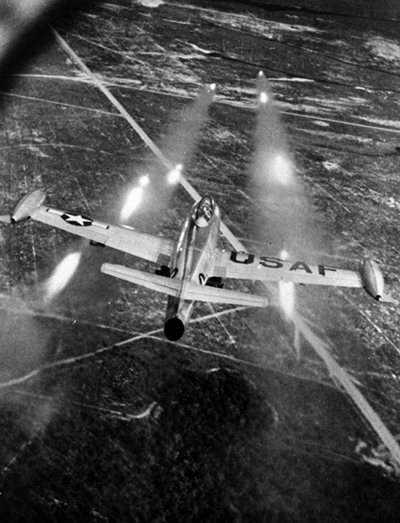 An F-84E Thunderjet launching bombs