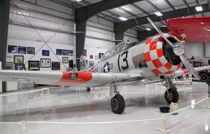 An AT-6 Harvard plane parked inside the Warhawk Air Museum