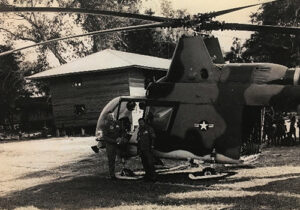 John Hoye standing in front of his HH-43F