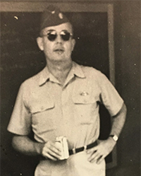 John Hoye, standing in uniform